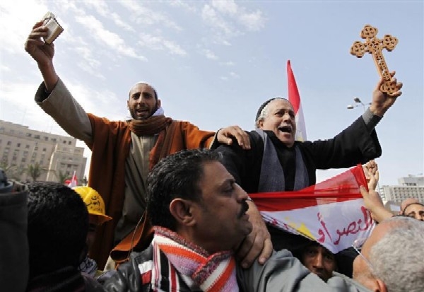 Muslim and Christian with Cross and the Koran at a rally on 6 February in Tahrir Square