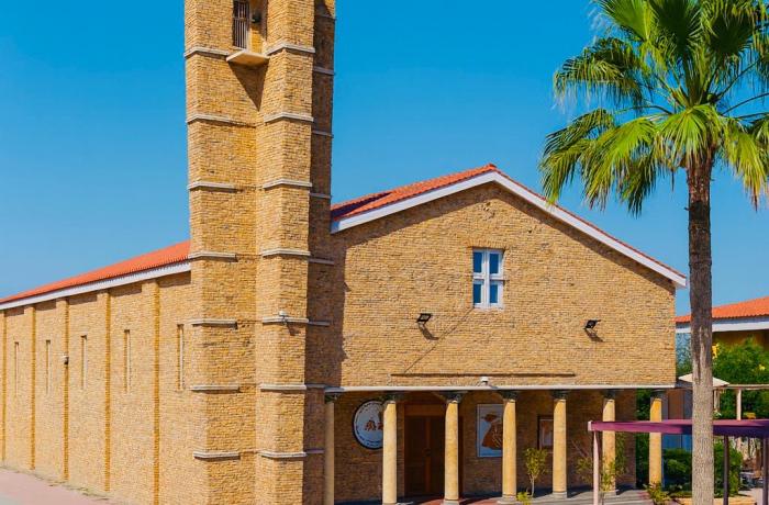 Kuwait: The Basilica of Our Lady of Arabia, a light illuminating a suffering church