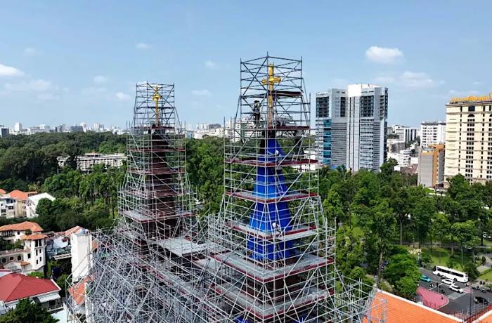 Saigon: Crosses return to the cathedral's spire, a visible sign of faith